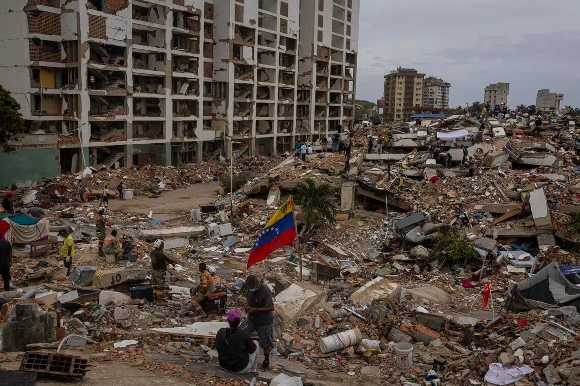 Rumors feed illusions of life under Venezuela quake ruins | International
