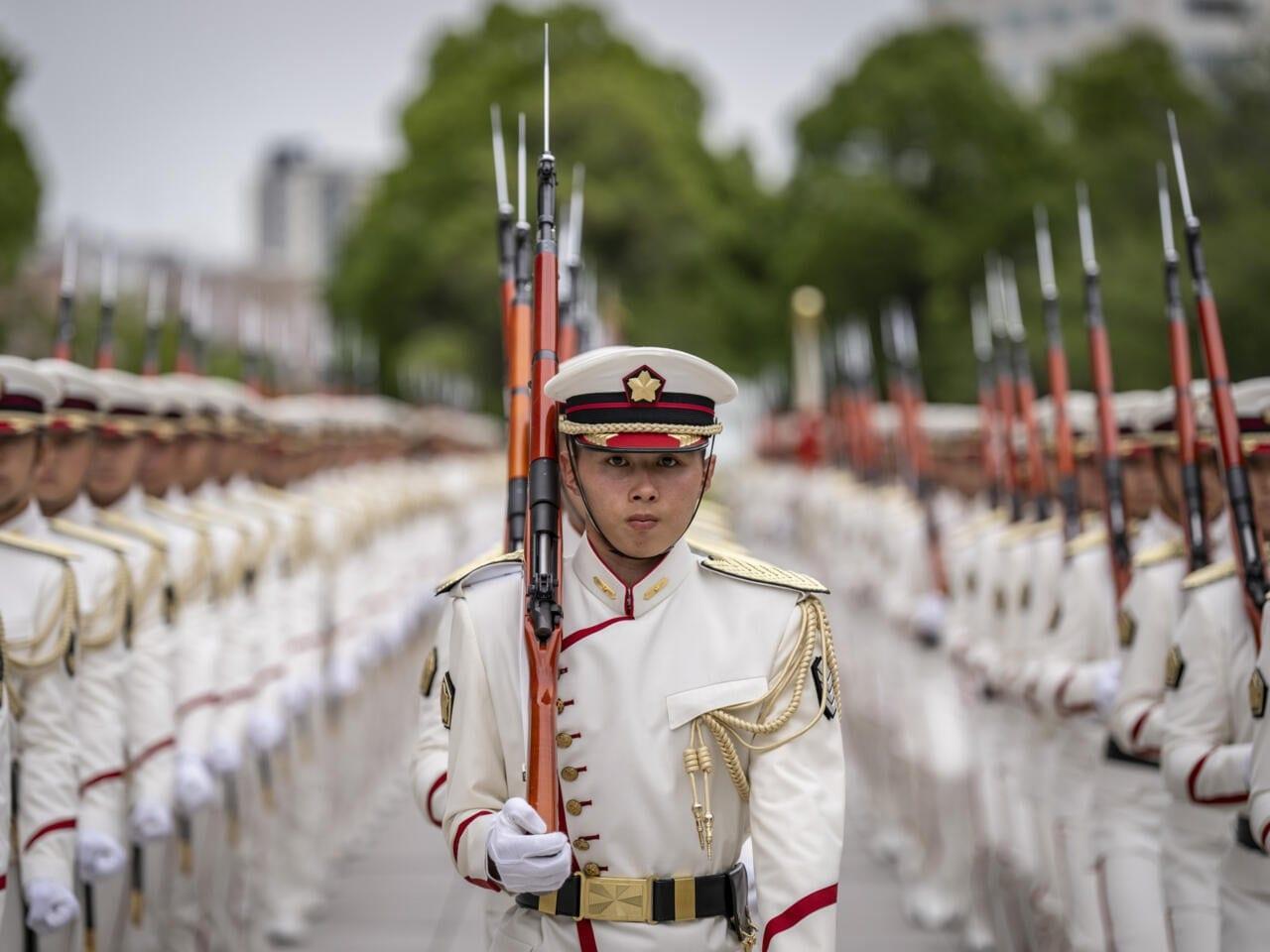 Japan sees 'urgent' need to boost military | International