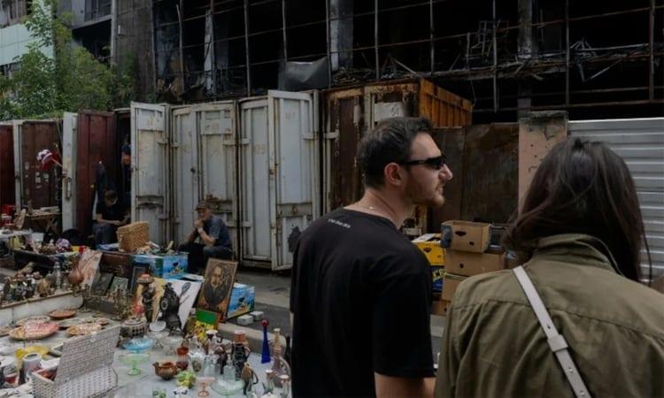 Kyiv's desperate vendors persevere outside obliterated flea market | Business