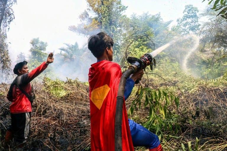 'Keep up the spirit': Indonesian teenage 'Superman' joins wildfire fight | International