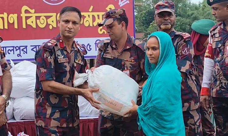 BGB distributes relief material among river eroded families in Jamalpur | District