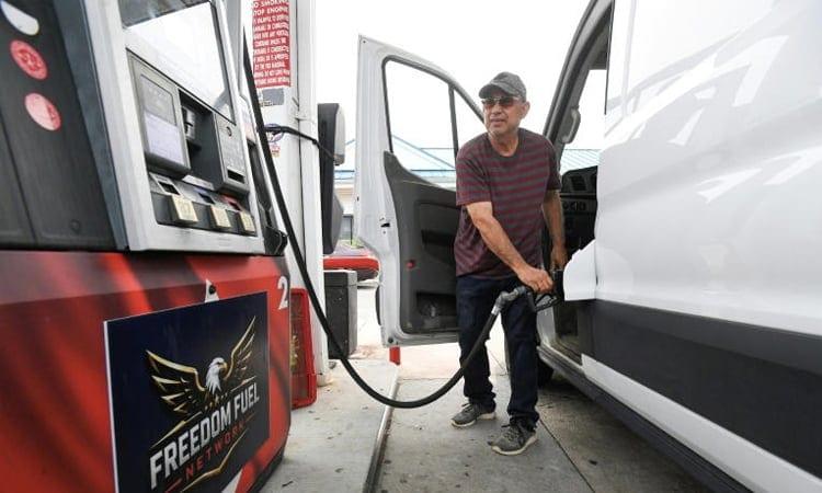 US stocks mostly up after data shows slightly lower inflation in July | Business