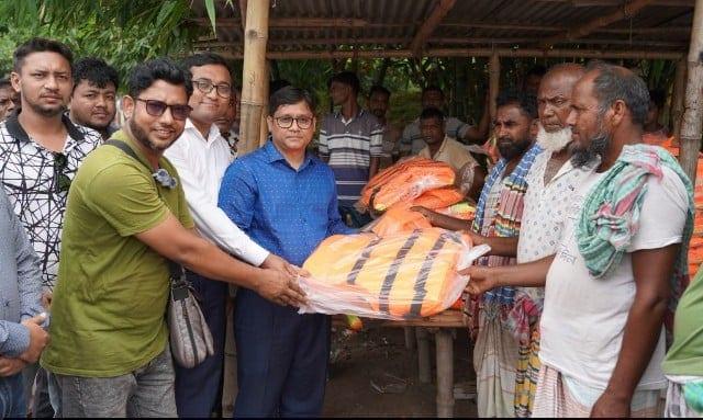 RCC Administrator distributes life jackets for safety of boat passengers | District
